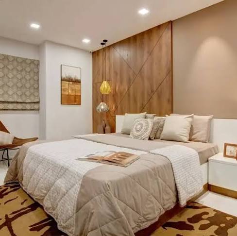 Master bedroom at Embassy Terrazza Juhu featuring elegant interiors and large windows.